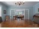 Dining room showing a long dining room table and chairs between white, glass-paneled doors at 709 Myrtle Dr, Rock Hill, SC 29730
