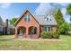 Charming brick home featuring a classic design, a welcoming front porch, and a well-maintained lawn at 709 Myrtle Dr, Rock Hill, SC 29730