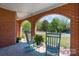 Charming front porch with brick arches and rocking chairs, perfect for relaxing at 709 Myrtle Dr, Rock Hill, SC 29730