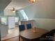 Compact kitchen featuring white cabinets, modern appliances, and a cozy dining area at 709 Myrtle Dr, Rock Hill, SC 29730