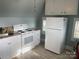 Efficient kitchen features white appliances, granite countertops, and sleek cabinetry at 709 Myrtle Dr, Rock Hill, SC 29730
