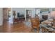 Cozy living room boasts hardwood floors, fireplace, comfortable seating, and seamless flow to other rooms at 709 Myrtle Dr, Rock Hill, SC 29730