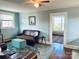 Inviting living room with hardwood floors, plush seating, a blue rug, and natural light at 709 Myrtle Dr, Rock Hill, SC 29730