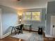 Bright office space features glass desk, neutral rug, hardwood floors, and sunny window at 709 Myrtle Dr, Rock Hill, SC 29730