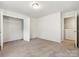 Comfortable bedroom with neutral carpet and ample space for personalization and a closet at 7113 Amberly Hills Rd, Charlotte, NC 28215