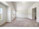 Bright bedroom featuring neutral carpet, a double hung window, and walk-in closet at 7113 Amberly Hills Rd, Charlotte, NC 28215