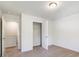 Bright bedroom features neutral walls, closet space, and carpeted floors for comfort at 7113 Amberly Hills Rd, Charlotte, NC 28215