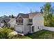Well-maintained two-story home with gray siding and a manicured front yard and landscaping at 7113 Amberly Hills Rd, Charlotte, NC 28215