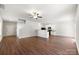 Spacious living area showcases hardwood floors, an open layout to kitchen, and staircase to the upper level at 7113 Amberly Hills Rd, Charlotte, NC 28215