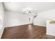 Expansive living area featuring hardwood floors, light walls, and smooth transition to other spaces with a modern ceiling fan at 7113 Amberly Hills Rd, Charlotte, NC 28215