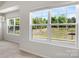 Brightly lit space showing the double hung windows looking out over the yard at 7113 Amberly Hills Rd, Charlotte, NC 28215