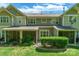 The backyard features screened in porches, mature landscaping and well-maintained lawn at 749 Petersburg Dr, Fort Mill, SC 29708
