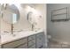 Double sink bathroom with large mirrors, under vanity storage, and modern fixtures at 749 Petersburg Dr, Fort Mill, SC 29708