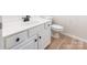 This powder room features a white vanity with dark hardware and modern toilet at 749 Petersburg Dr, Fort Mill, SC 29708
