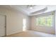 Spacious bedroom with a tray ceiling and access to the Primary bath at 749 Petersburg Dr, Fort Mill, SC 29708