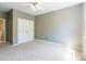 This bedroom features double door closet, carpeted floors and neutral walls at 749 Petersburg Dr, Fort Mill, SC 29708