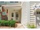 Covered entryway of townhome with trimmed bushes and light colored paint at 749 Petersburg Dr, Fort Mill, SC 29708