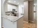 Bright kitchen featuring granite counters, white cabinetry, and stainless steel appliances at 749 Petersburg Dr, Fort Mill, SC 29708