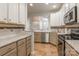Updated kitchen features stainless steel appliances, granite countertops, and tile backsplash at 749 Petersburg Dr, Fort Mill, SC 29708