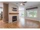 Open-concept living room with fireplace, hardwood floors, and a dining area at 749 Petersburg Dr, Fort Mill, SC 29708