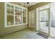 This covered patio offers an enclosed space for additional seating and natural light at 749 Petersburg Dr, Fort Mill, SC 29708