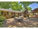 Lovely brick patio with an outdoor dining set, perfect for enjoying outdoor meals and entertaining at 751 Lansdowne Rd, Charlotte, NC 28270