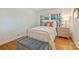 Bright bedroom with hardwood floors, bench, and large window at 751 Lansdowne Rd, Charlotte, NC 28270