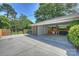 Attached carport features a concrete floor with space for outdoor grilling at 751 Lansdowne Rd, Charlotte, NC 28270