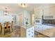 Kitchen with white cabinets, eat-in dining, offering a seamless transition to additional living spaces at 751 Lansdowne Rd, Charlotte, NC 28270