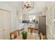 Bright eat-in kitchen with tile flooring, stainless steel appliances and center island at 751 Lansdowne Rd, Charlotte, NC 28270