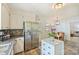 Practical kitchen featuring white cabinets, stainless steel appliances and a eat-in dining area at 751 Lansdowne Rd, Charlotte, NC 28270