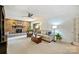 Cozy living room featuring brick fireplace, plush seating, and natural light at 751 Lansdowne Rd, Charlotte, NC 28270