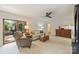 Comfortable living room with neutral carpet and doors that open to outdoor views at 751 Lansdowne Rd, Charlotte, NC 28270