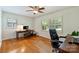 Bright home office with hardwood floors, desk, and natural light at 751 Lansdowne Rd, Charlotte, NC 28270