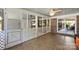 Cozy screened porch with tile flooring and a ceiling fan, perfect for relaxing and enjoying the outdoors at 751 Lansdowne Rd, Charlotte, NC 28270