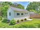 Charming shed in a well-maintained backyard with lush landscaping, offering extra storage or workspace at 751 Lansdowne Rd, Charlotte, NC 28270