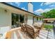 Outdoor seating on back deck, ideal for relaxing and soaking in the sun at 8330 Fallsdale Dr, Charlotte, NC 28214