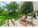 Enjoy relaxing on the back deck overlooking the lush, green backyard at 8330 Fallsdale Dr, Charlotte, NC 28214