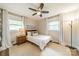 Charming bedroom with natural light, neutral decor, and a ceiling fan at 8330 Fallsdale Dr, Charlotte, NC 28214