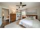 Comfortable bedroom featuring natural light, hardwood floors, and a decorative dresser at 8330 Fallsdale Dr, Charlotte, NC 28214