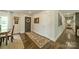 Inviting entryway with hardwood floors, a decorative rug, and stylish front door at 8330 Fallsdale Dr, Charlotte, NC 28214