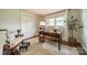 Cozy home office with natural light, hardwood floors, and a classic desk at 8330 Fallsdale Dr, Charlotte, NC 28214