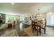 Bright, open kitchen and dining area with large island, pendant lighting, and modern appliances at 8330 Fallsdale Dr, Charlotte, NC 28214