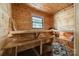 A great place to unwind in this private sauna with wooden benches, bucket and rocky heat source at 8330 Fallsdale Dr, Charlotte, NC 28214