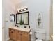 Bathroom features a double vanity, a framed mirror, and toilet at 8921 Magnolia Heights Ct, Charlotte, NC 28270
