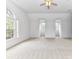 Large bedroom with light carpet, lots of natural light, and white walls at 8921 Magnolia Heights Ct, Charlotte, NC 28270