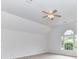 Bonus room with natural light from large windows and ceiling fan at 8921 Magnolia Heights Ct, Charlotte, NC 28270