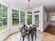 Charming breakfast nook with bright windows overlooking a serene backyard, creating a cozy dining experience at 8921 Magnolia Heights Ct, Charlotte, NC 28270
