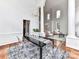 Elegant dining area featuring soaring ceilings, modern chandelier, and easy access to the living room and front entry at 8921 Magnolia Heights Ct, Charlotte, NC 28270