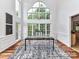 Bright dining room area with large windows, modern lighting, and contemporary furnishings, creating a welcoming atmosphere at 8921 Magnolia Heights Ct, Charlotte, NC 28270